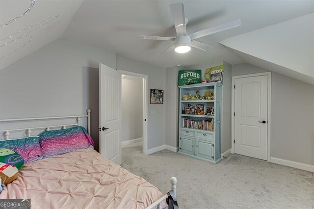 440 S Alexander St, Buford, GA 30518 - bedroom with vaulted ceiling, light colored carpet, baseboards, and a ceiling fan
