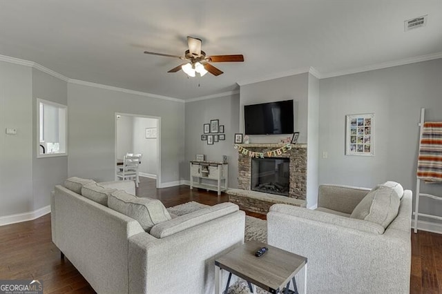 440 S Alexander St, Buford, GA 30518 - living room with ceiling fan, baseboards, dark wood-type flooring, a stone fireplace, and crown molding