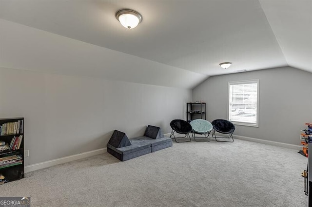 440 S Alexander St, Buford, GA 30518 - living area with lofted ceiling, carpet floors, and baseboards