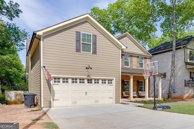 440 S Alexander St, Buford, GA 30518 - traditional-style house with an attached garage, driveway, and a porch