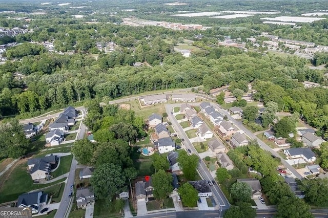 440 S Alexander St, Buford, GA 30518 - aerial view of property and surrounding area featuring nearby suburban area and a forest