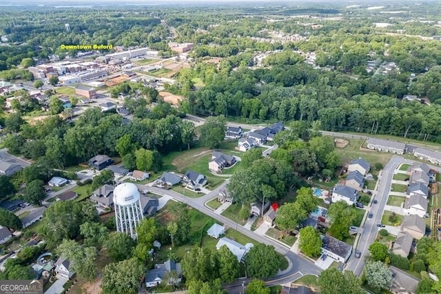440 S Alexander St, Buford, GA 30518 - aerial overview of property's location with nearby suburban area and a heavily wooded area