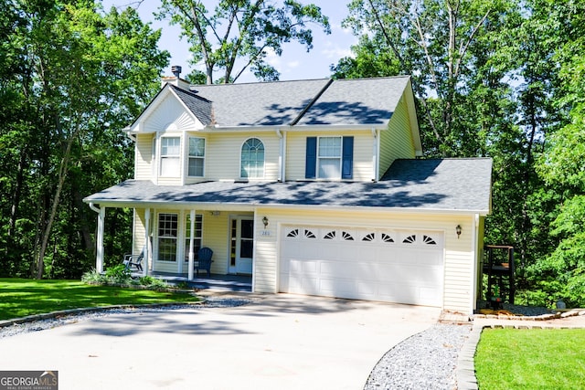 280 Cherokee Trce, Dahlonega, GA 30533 - view of front of property featuring covered porch, concrete driveway, roof with shingles, a front lawn, and a garage