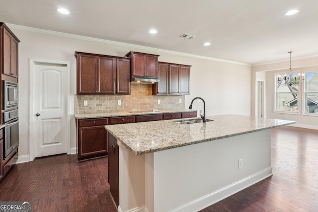4416 Links Blvd, Jefferson, GA 30549 - kitchen featuring a sink, under cabinet range hood, dark wood finished floors, a chandelier, and crown molding
