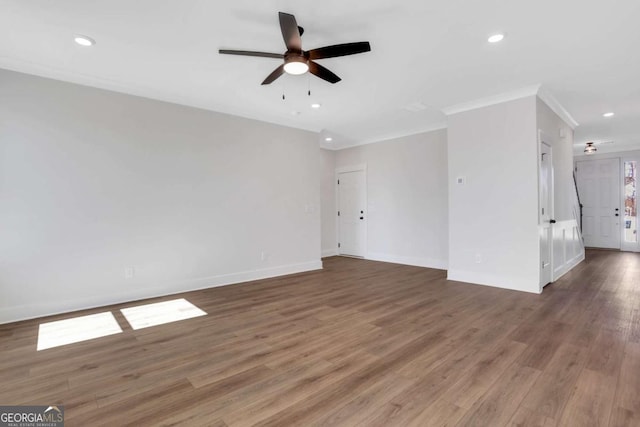 6775 Cambridge Dr, Flowery Branch, GA 30542 - spare room with a ceiling fan, baseboards, wood finished floors, recessed lighting, and crown molding
