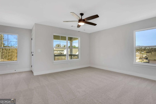 6775 Cambridge Dr, Flowery Branch, GA 30542 - carpeted empty room with a ceiling fan and baseboards