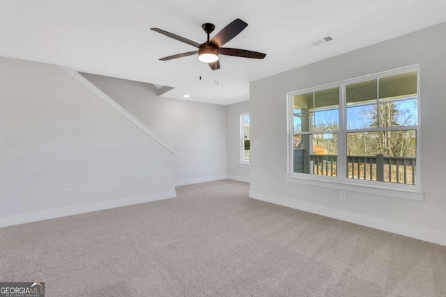 6775 Cambridge Dr, Flowery Branch, GA 30542 - unfurnished living room with carpet flooring, ceiling fan, and baseboards