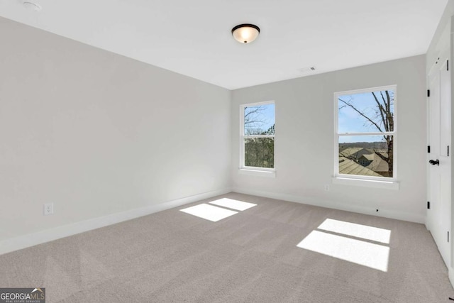 6775 Cambridge Dr, Flowery Branch, GA 30542 - spare room featuring carpet flooring and plenty of natural light