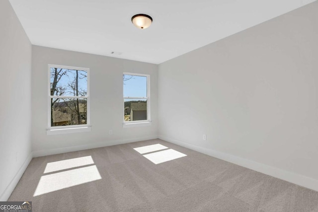 6775 Cambridge Dr, Flowery Branch, GA 30542 - empty room featuring carpet flooring and baseboards