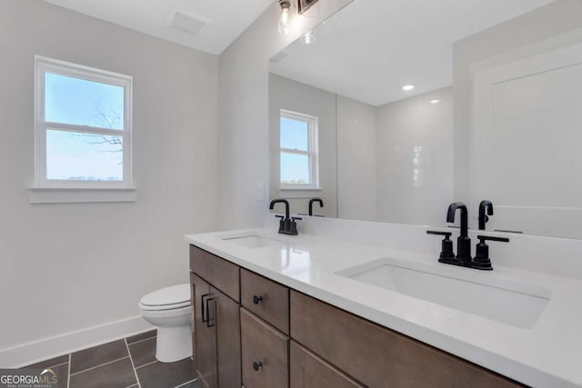 6775 Cambridge Dr, Flowery Branch, GA 30542 - bathroom with toilet, double vanity, baseboards, tile patterned floors, and recessed lighting