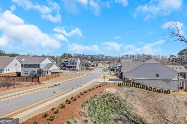 6775 Cambridge Dr, Flowery Branch, GA 30542 - view of asphalt street featuring sidewalks, a residential view, and curbs