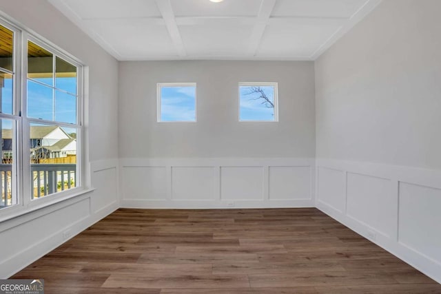 6775 Cambridge Dr, Flowery Branch, GA 30542 - spare room with coffered ceiling, beamed ceiling, a wainscoted wall, wood finished floors, and a decorative wall