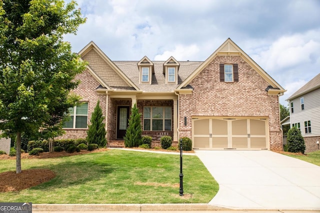 2665 Crowbrook Way, Cumming, GA 30040 - craftsman inspired home featuring brick siding, concrete driveway, and a front yard