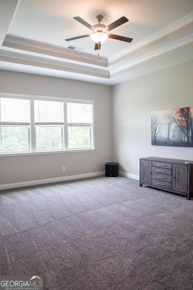 2665 Crowbrook Way, Cumming, GA 30040 - unfurnished living room with a raised ceiling, carpet, ceiling fan, and crown molding
