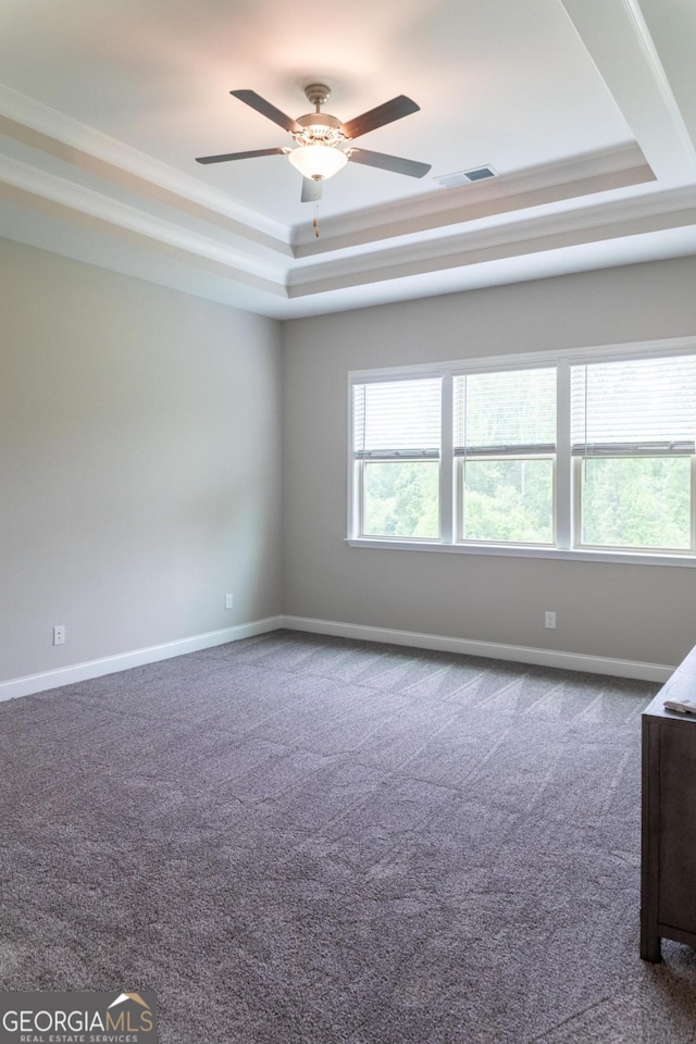 2665 Crowbrook Way, Cumming, GA 30040 - empty room with a raised ceiling, dark colored carpet, a ceiling fan, and ornamental molding