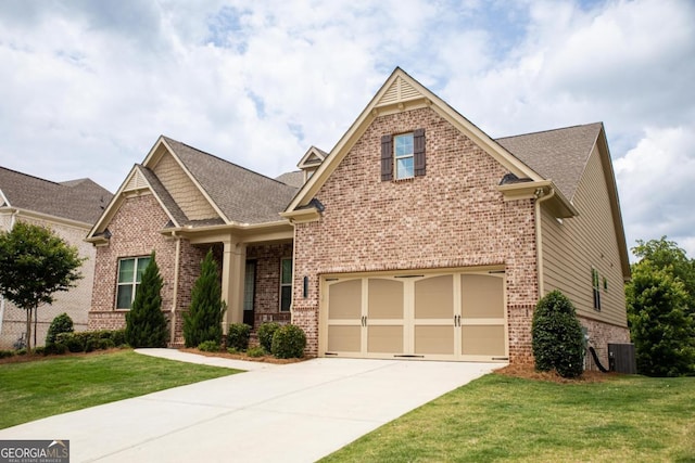2665 Crowbrook Way, Cumming, GA 30040 - craftsman house featuring brick siding, driveway, a front yard, and roof with shingles