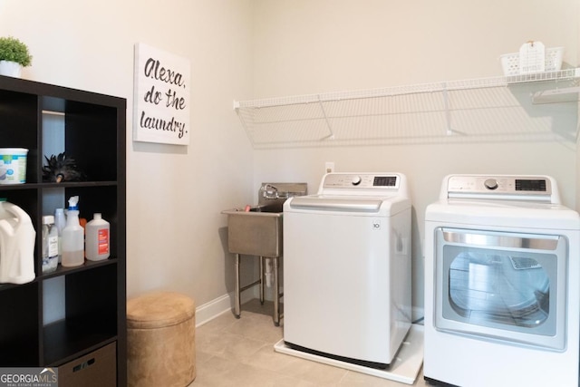 2665 Crowbrook Way, Cumming, GA 30040 - laundry area featuring washer and clothes dryer and light tile patterned floors