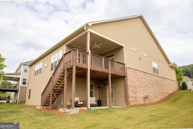 2665 Crowbrook Way, Cumming, GA 30040 - rear view of house with ceiling fan, brick siding, a lawn, and a deck