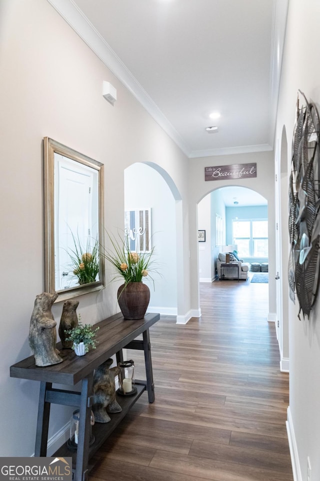 2665 Crowbrook Way, Cumming, GA 30040 - hall with arched walkways, ornamental molding, and dark wood-style flooring