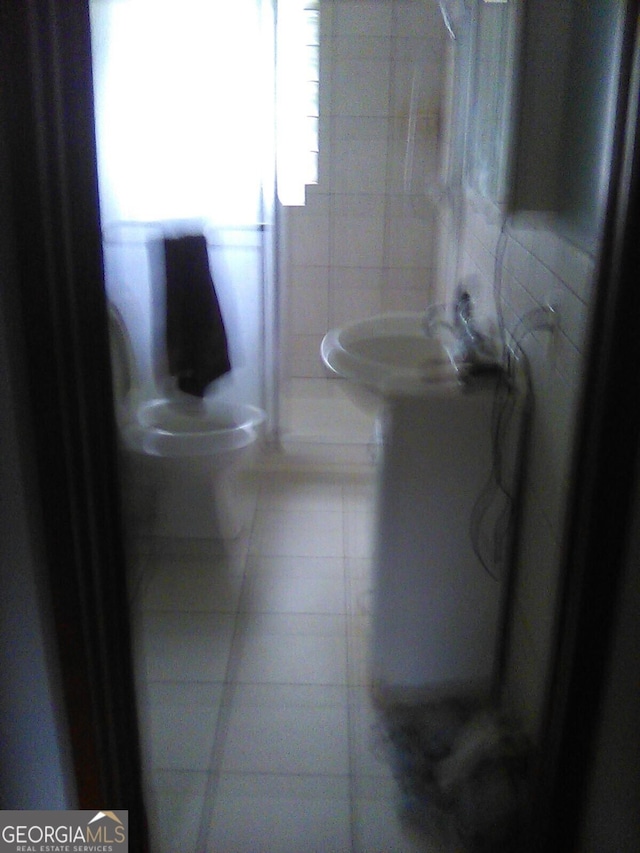 624 Newtown Creek Loop NE, Calhoun, GA 30701 - bathroom with tile patterned flooring, tile walls, and toilet