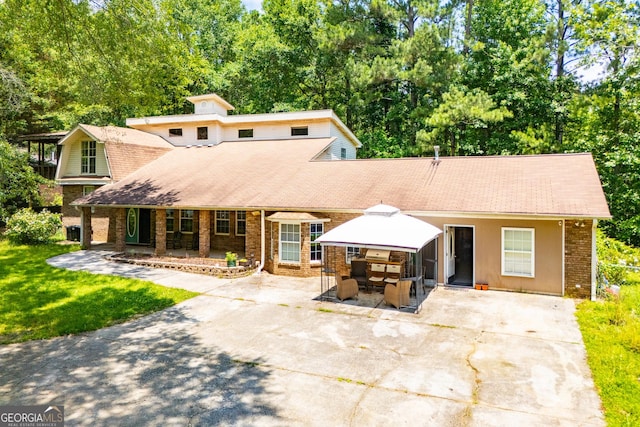 258 Big Oak Rd, Whitesburg, GA 30185 - view of front of property featuring brick siding, concrete driveway, a porch, and roof with shingles