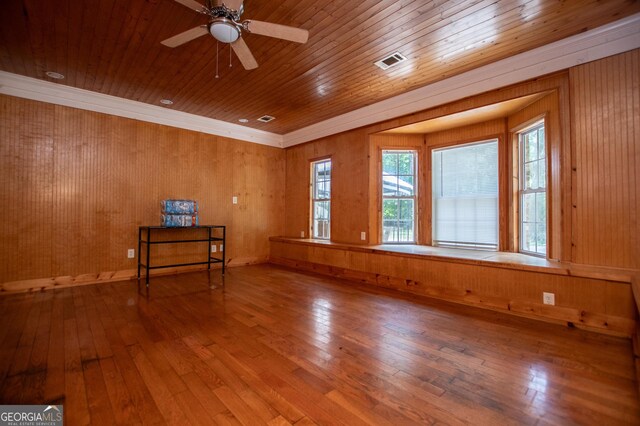 258 Big Oak Rd, Whitesburg, GA 30185 - unfurnished room featuring hardwood / wood-style flooring, wooden ceiling, ceiling fan, wooden walls, and ornamental molding
