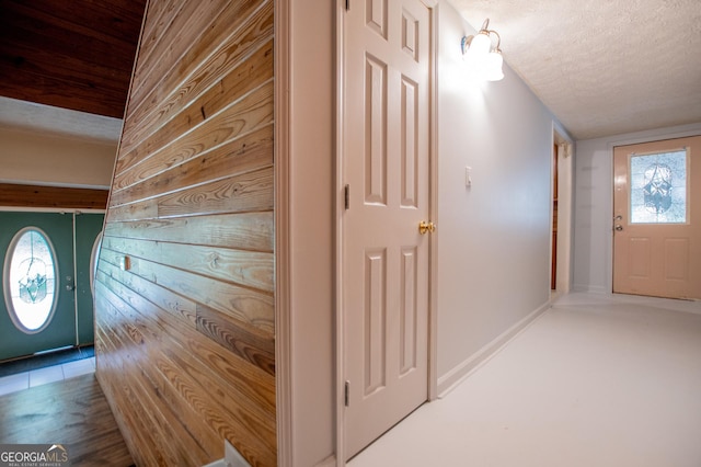 258 Big Oak Rd, Whitesburg, GA 30185 - foyer with a textured ceiling, wood walls, and baseboards