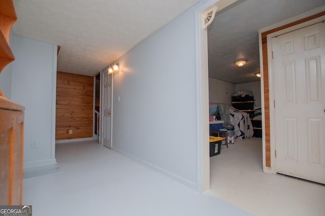 258 Big Oak Rd, Whitesburg, GA 30185 - corridor with a textured ceiling, baseboards, carpet, and wood walls