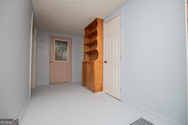 258 Big Oak Rd, Whitesburg, GA 30185 - hall featuring a textured ceiling and baseboards