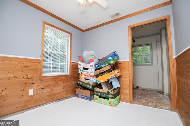 258 Big Oak Rd, Whitesburg, GA 30185 - bedroom featuring wood walls, wainscoting, ornamental molding, and a ceiling fan