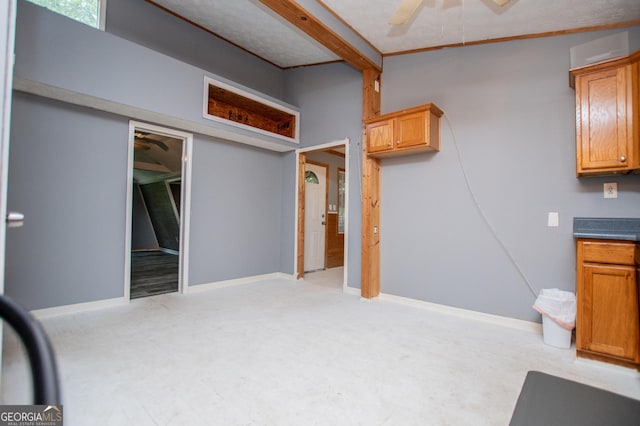 258 Big Oak Rd, Whitesburg, GA 30185 - interior space with ceiling fan, light colored carpet, beam ceiling, and brown cabinets