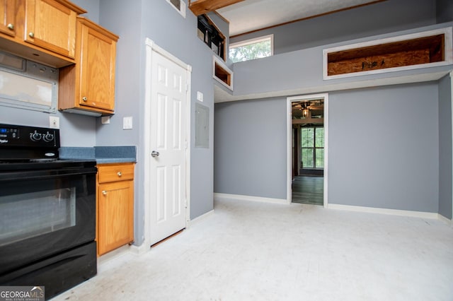 258 Big Oak Rd, Whitesburg, GA 30185 - kitchen with black range with electric cooktop, healthy amount of natural light, and baseboards