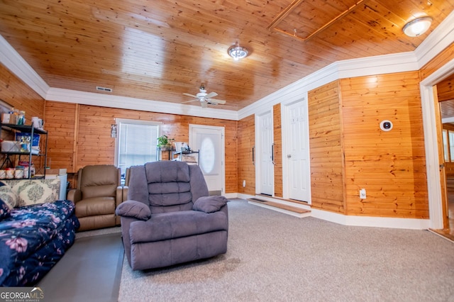 258 Big Oak Rd, Whitesburg, GA 30185 - carpeted living room with crown molding, wooden ceiling, wood walls, ceiling fan, and baseboards