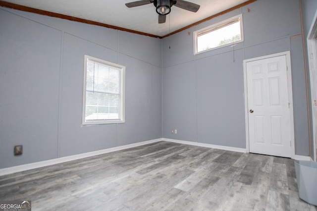 258 Big Oak Rd, Whitesburg, GA 30185 - spare room featuring ceiling fan, wood finished floors, and crown molding