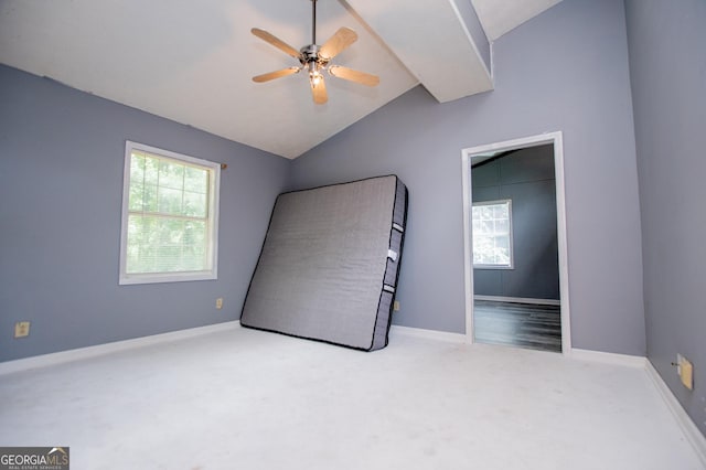 258 Big Oak Rd, Whitesburg, GA 30185 - unfurnished bedroom with lofted ceiling, multiple windows, carpet, baseboards, and a ceiling fan