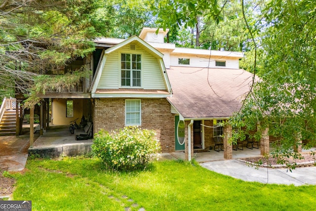 258 Big Oak Rd, Whitesburg, GA 30185 - view of front of property with brick siding, a patio, a shingled roof, stairway, and a front yard