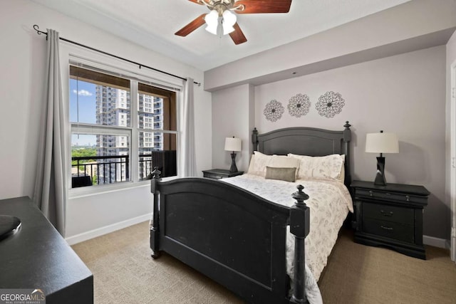 1101 Juniper St NE Unit 1216, Atlanta, GA 30309 - bedroom with light colored carpet, baseboards, and a ceiling fan