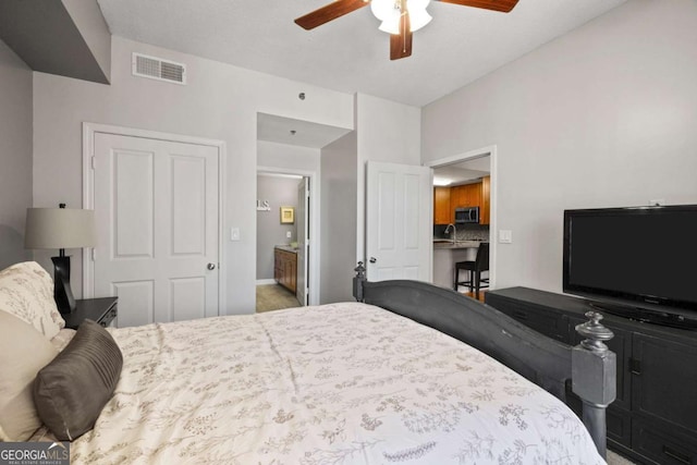 1101 Juniper St NE Unit 1216, Atlanta, GA 30309 - bedroom with a sink, a ceiling fan, carpet flooring, and baseboards