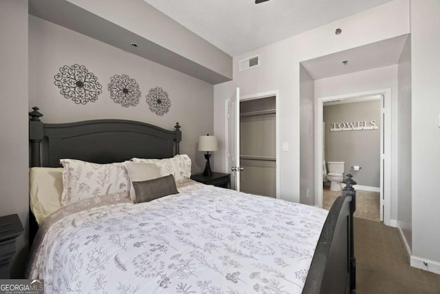 1101 Juniper St NE Unit 1216, Atlanta, GA 30309 - bedroom featuring dark carpet, baseboards, a closet, and ensuite bath