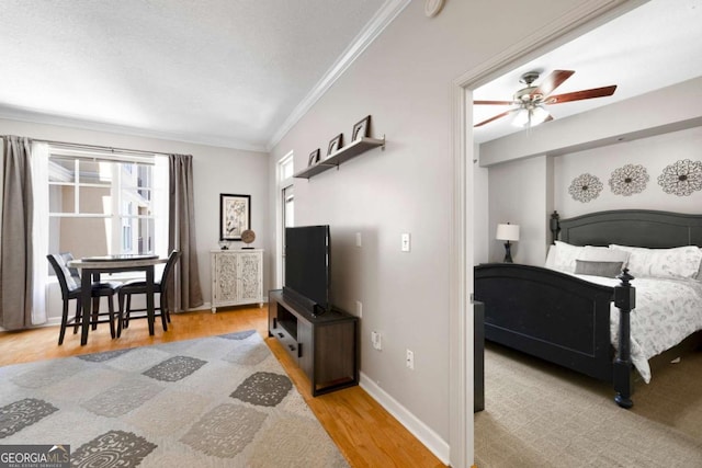 1101 Juniper St NE Unit 1216, Atlanta, GA 30309 - bedroom with crown molding, light wood finished floors, and baseboards