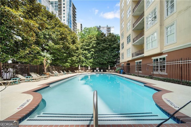 1101 Juniper St NE Unit 1216, Atlanta, GA 30309 - community pool featuring a patio area