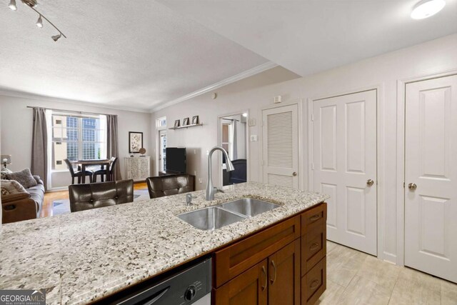 1101 Juniper St NE Unit 1216, Atlanta, GA 30309 - kitchen featuring open floor plan, crown molding, light stone countertops, dishwasher, and brown cabinetry