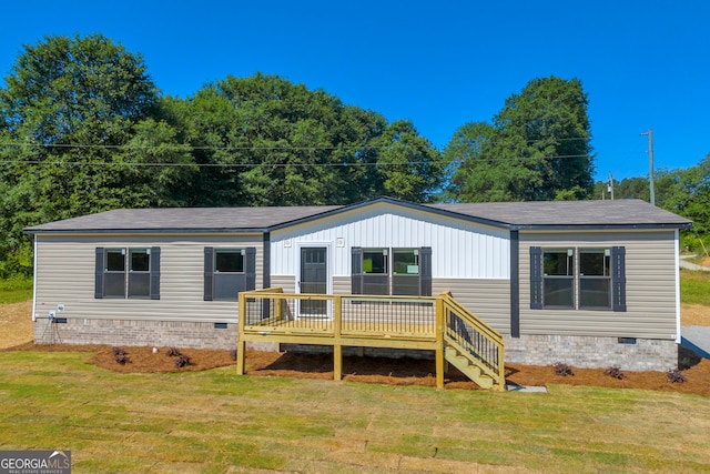 33 Marigold Dr, Carnesville, GA 30521 - view of front of property with crawl space, a deck, and a front yard