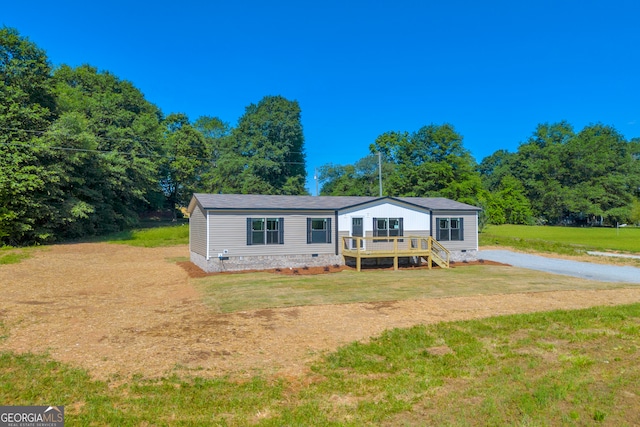 33 Marigold Dr, Carnesville, GA 30521 - manufactured / mobile home with crawl space, a front lawn, and a wooden deck