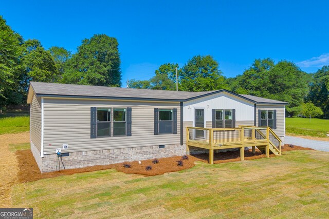 33 Marigold Dr, Carnesville, GA 30521 - manufactured / mobile home with crawl space, a wooden deck, and a front lawn