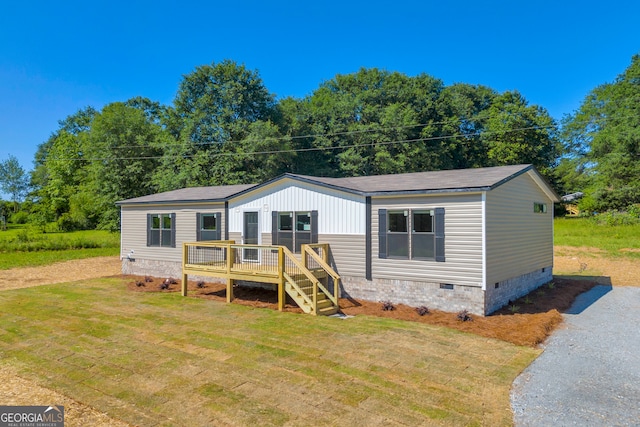 33 Marigold Dr, Carnesville, GA 30521 - manufactured / mobile home featuring crawl space, a deck, a front lawn, and driveway