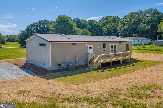 33 Marigold Dr, Carnesville, GA 30521 - back of property with crawl space, a wooden deck, a lawn, and central air condition unit