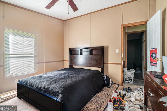 23 Wood Bine Ln, Crawford, GA 30630 - bedroom featuring a ceiling fan, crown molding, and a textured ceiling