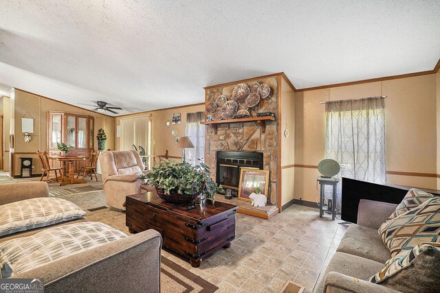 23 Wood Bine Ln, Crawford, GA 30630 - living room with a ceiling fan, baseboards, a stone fireplace, lofted ceiling, and crown molding