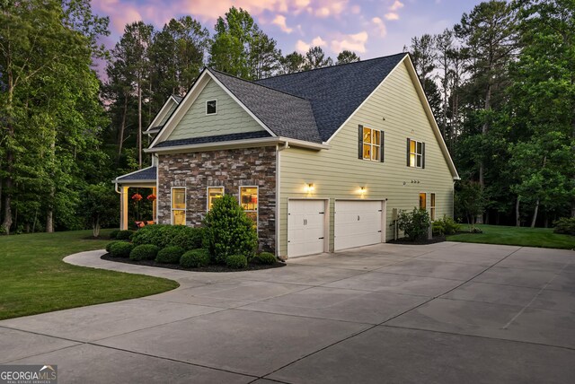 372 Abbington Way, Clarkesville, GA 30523 - view of front facade featuring driveway, a garage, a front yard, a shingled roof, and stone siding
